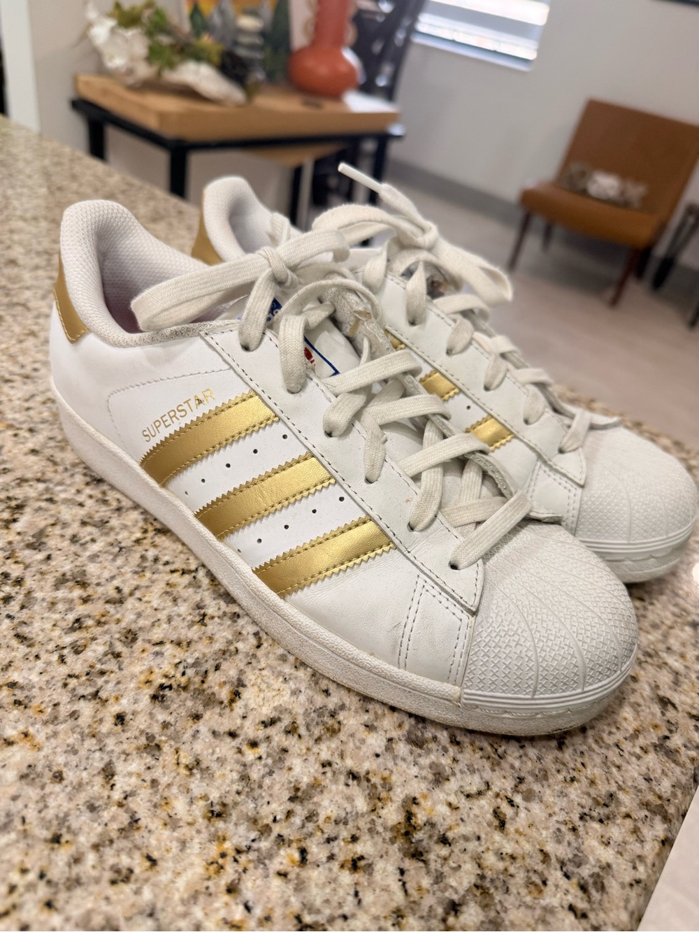 adidas Women’s Superstar Sneakers in White and Gold